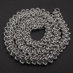 Bright silver aluminum chain mail necklace on a grey background.