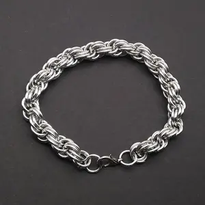 Bright silver aluminum chain mail bracelet on a dark grey background.